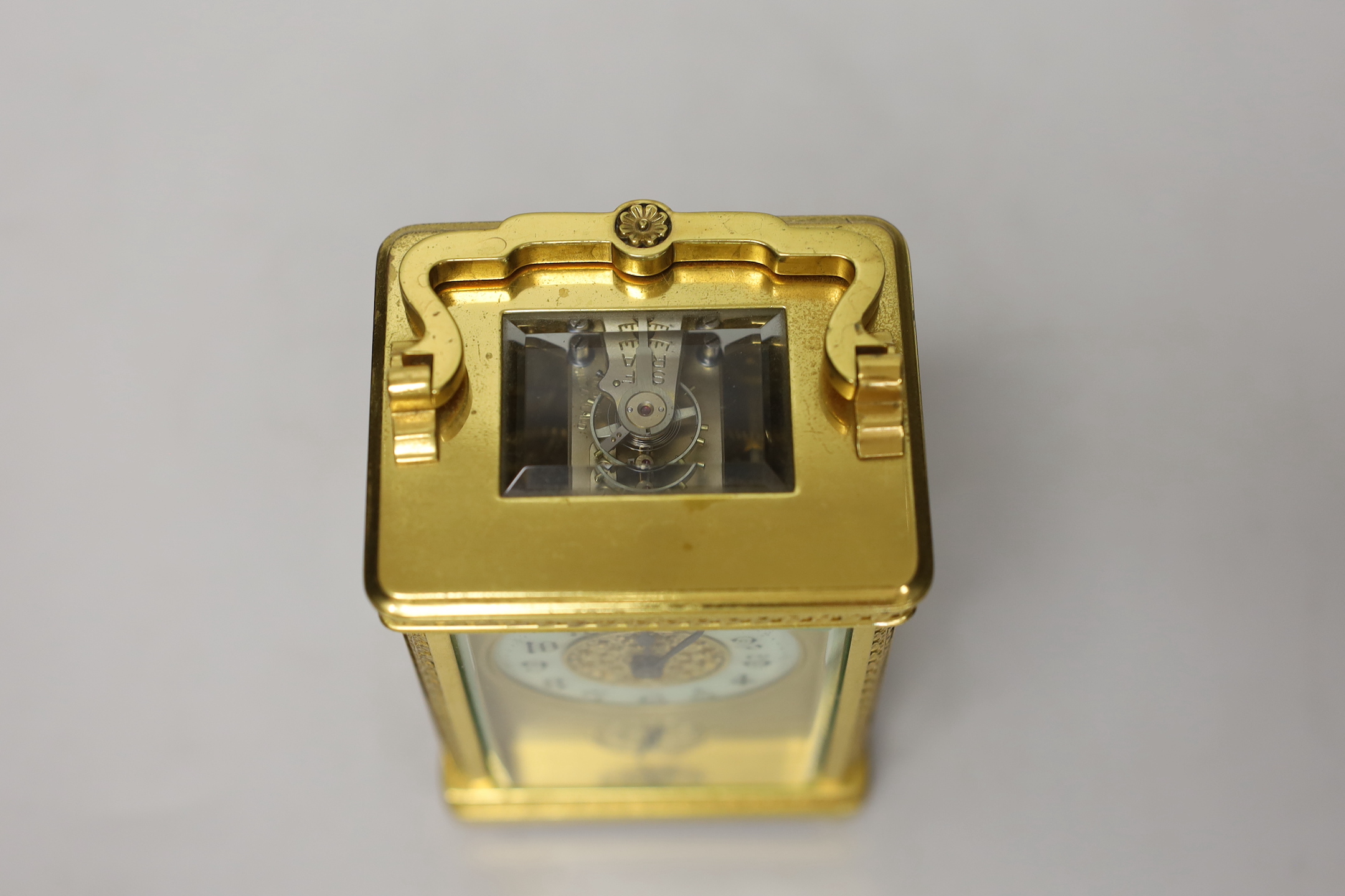 An Edwardian brass carriage timepiece with alarm, 12cm